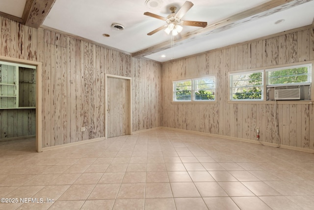 spare room with tile patterned flooring, visible vents, beamed ceiling, and baseboards