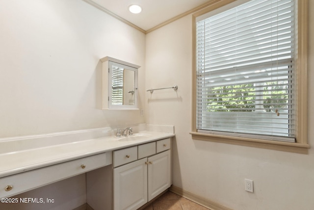 bathroom with vanity, ornamental molding, a wealth of natural light, and tile patterned floors