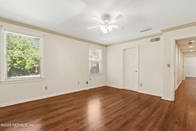 unfurnished bedroom with multiple windows, visible vents, wood finished floors, and ornamental molding