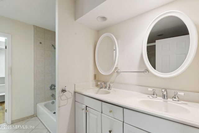 bathroom with double vanity, tile patterned flooring, tub / shower combination, and a sink