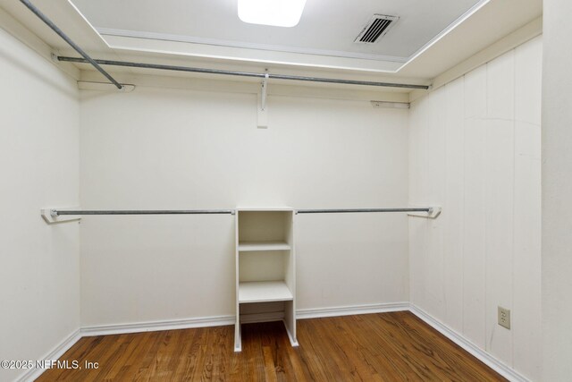 spacious closet with visible vents and wood finished floors