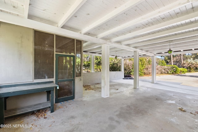 view of patio featuring a sunroom