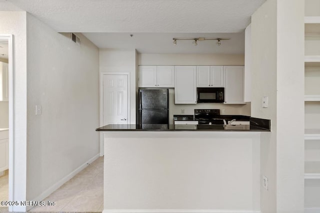 kitchen featuring white cabinets, dark countertops, a peninsula, a textured ceiling, and black appliances