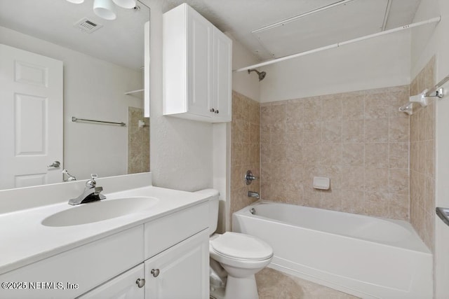 full bathroom featuring visible vents, toilet, washtub / shower combination, vanity, and tile patterned flooring