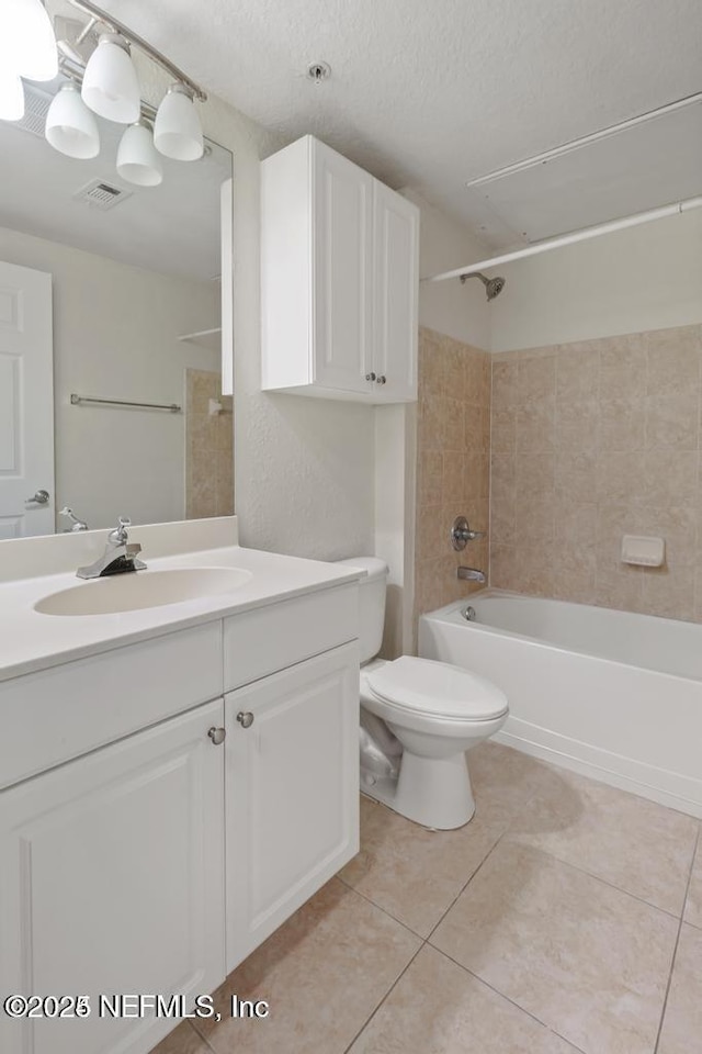 bathroom with visible vents, bathing tub / shower combination, toilet, tile patterned flooring, and vanity