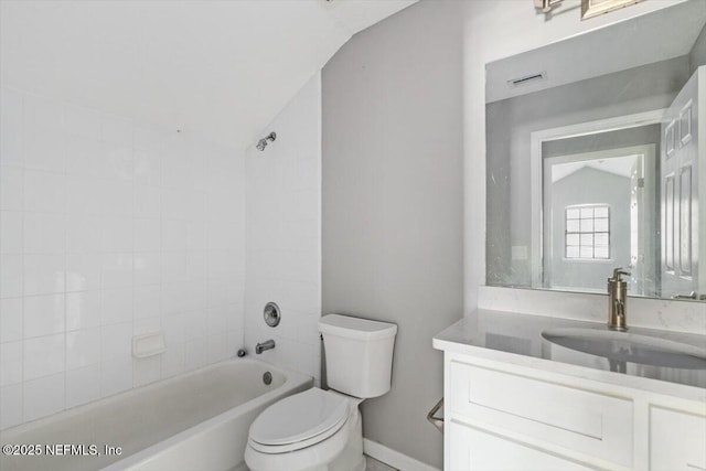 full bathroom with vaulted ceiling, visible vents, vanity, and toilet