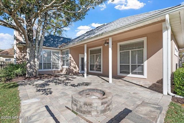 view of patio / terrace featuring an outdoor fire pit and ceiling fan