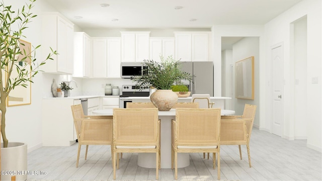 92 Hogan Ct, Saint Augustine, FL 32092 - dining room with light wood-style flooring and baseboards
