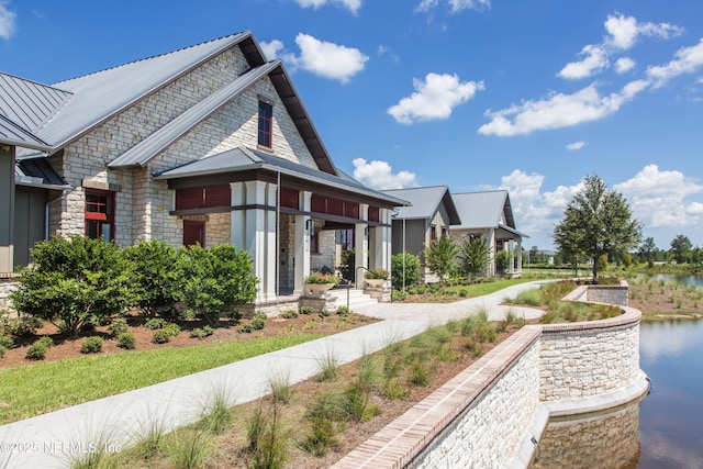 92 Hogan Ct, Saint Augustine, FL 32092 - exterior space with a standing seam roof, a water view, stone siding, and metal roof