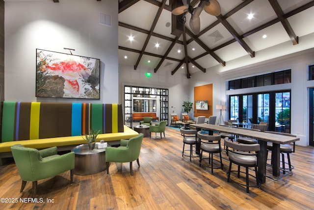 92 Hogan Ct, Saint Augustine, FL 32092 - playroom featuring visible vents, a towering ceiling, and wood-type flooring