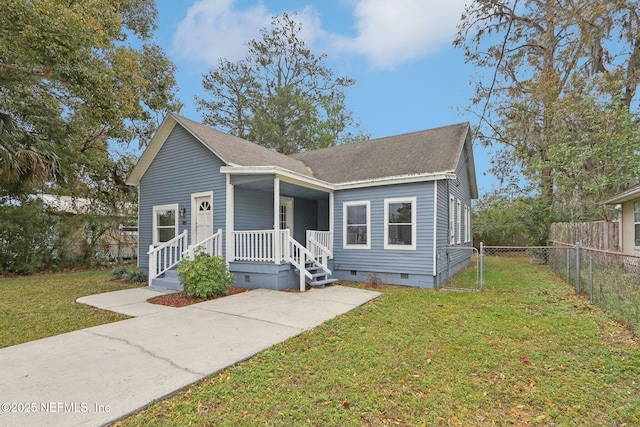 bungalow-style house featuring roof with shingles, a porch, crawl space, fence, and a front lawn