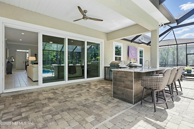 294 Mahi Dr, Ponte Vedra, FL 32081 - view of patio / terrace with ceiling fan, exterior kitchen, outdoor wet bar, grilling area, and glass enclosure
