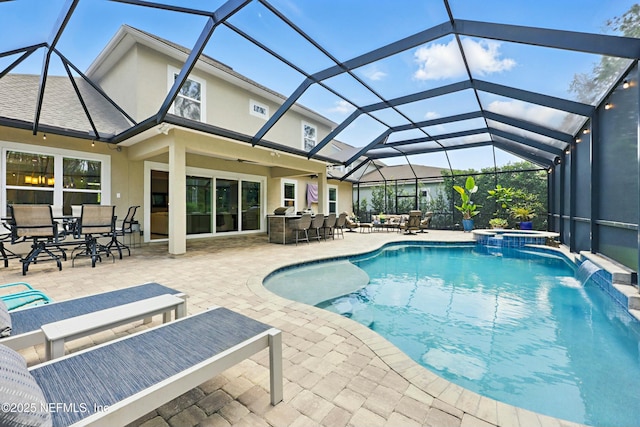 294 Mahi Dr, Ponte Vedra, FL 32081 - view of swimming pool featuring outdoor dining space, a patio, outdoor dry bar, a pool with connected hot tub, and glass enclosure