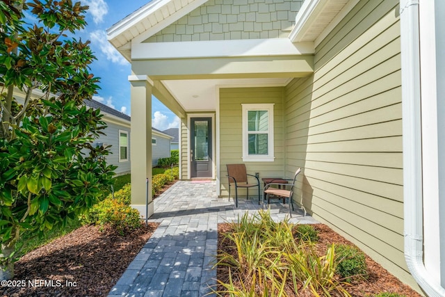 doorway to property featuring a patio