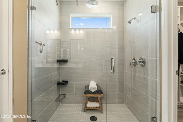 bathroom featuring a shower stall