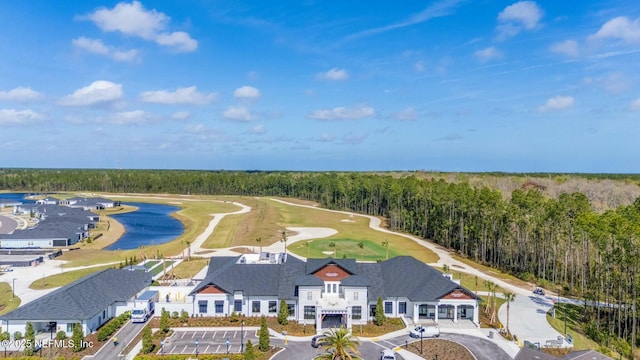 bird's eye view with a wooded view