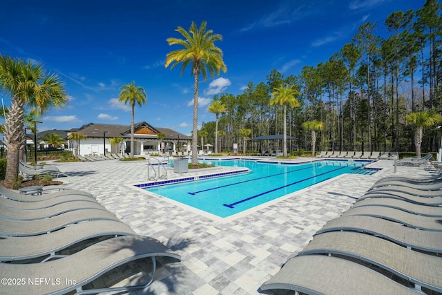 community pool featuring a patio and a gazebo