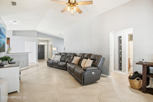 living area featuring light tile patterned floors, baseboards, visible vents, lofted ceiling, and ceiling fan