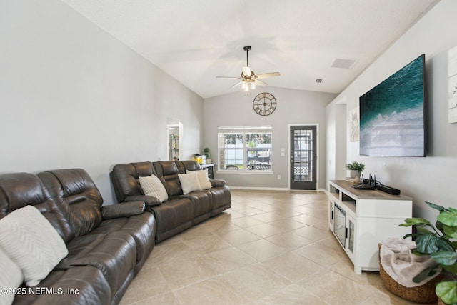 living room featuring visible vents, ceiling fan, baseboards, vaulted ceiling, and light tile patterned floors