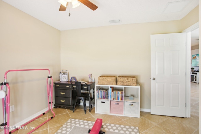 recreation room featuring tile patterned flooring, a ceiling fan, and baseboards