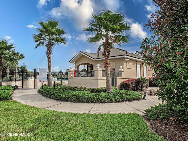 view of property exterior with fence and stucco siding