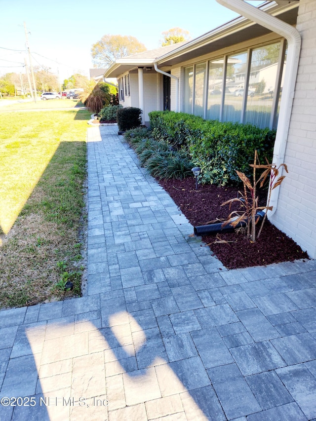 view of property exterior featuring a yard