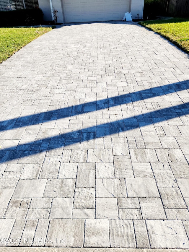 exterior details with decorative driveway