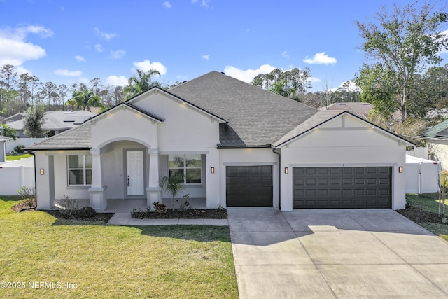 single story home featuring a front lawn, an attached garage, fence, and stucco siding