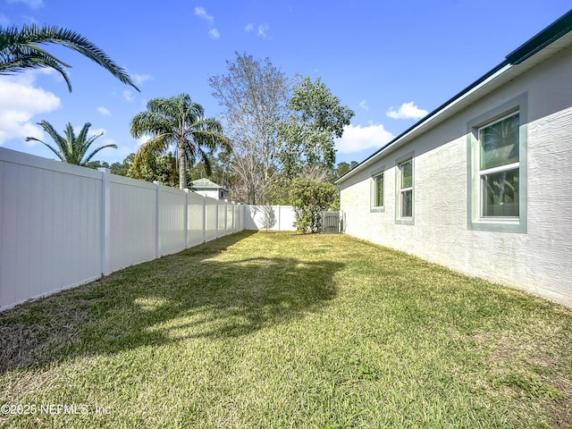 view of yard with a fenced backyard