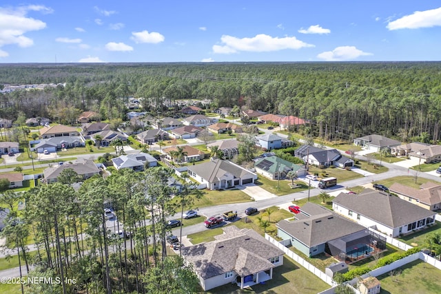 aerial view featuring a residential view and a view of trees