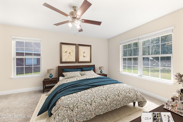 bedroom featuring carpet floors, baseboards, and a ceiling fan