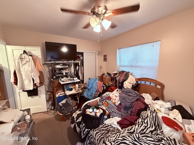 carpeted bedroom with ceiling fan