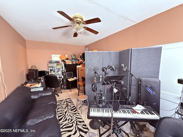 tiled home office featuring a ceiling fan