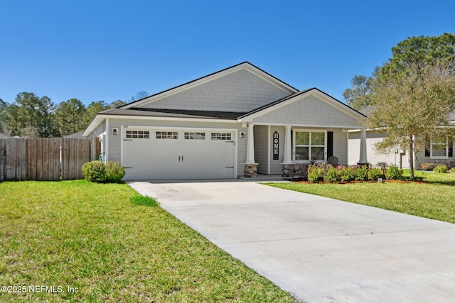 craftsman inspired home with a garage, driveway, a front lawn, and fence