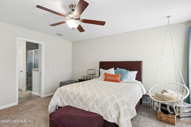 bedroom with visible vents, ensuite bathroom, carpet flooring, ceiling fan, and baseboards