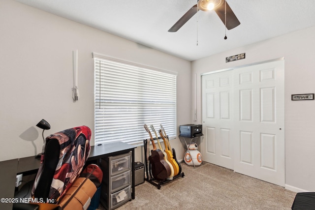 playroom with carpet and a ceiling fan