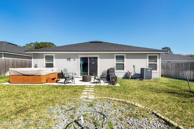 back of house with a patio, a fenced backyard, central air condition unit, a lawn, and stucco siding