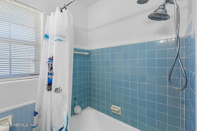 full bathroom featuring shower / bath combo with shower curtain