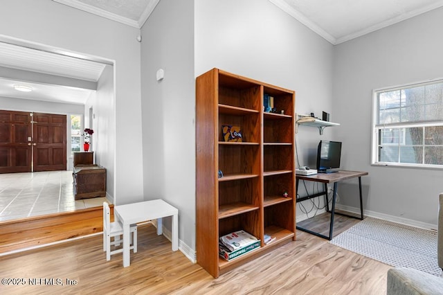 home office with crown molding, wood finished floors, and baseboards