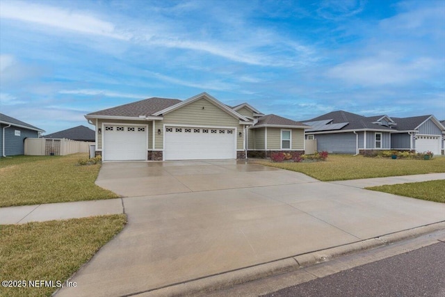 ranch-style home featuring a front yard, stone siding, driveway, and an attached garage