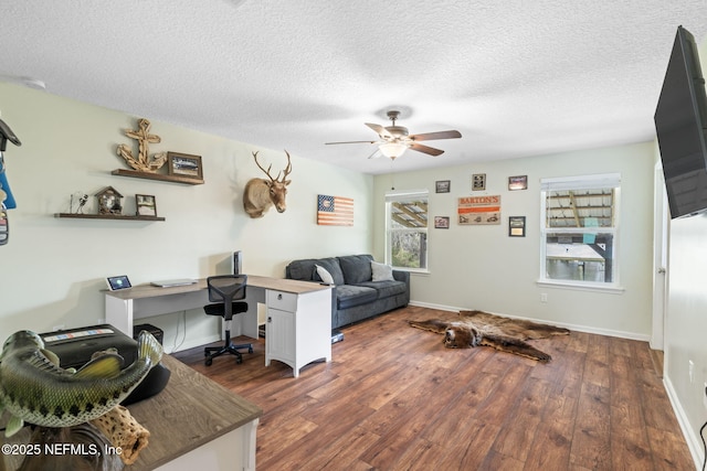 office with ceiling fan, a textured ceiling, and wood finished floors