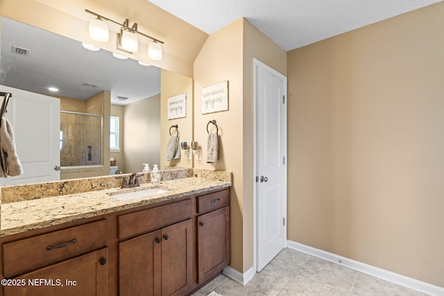 full bathroom with toilet, vanity, visible vents, baseboards, and a stall shower