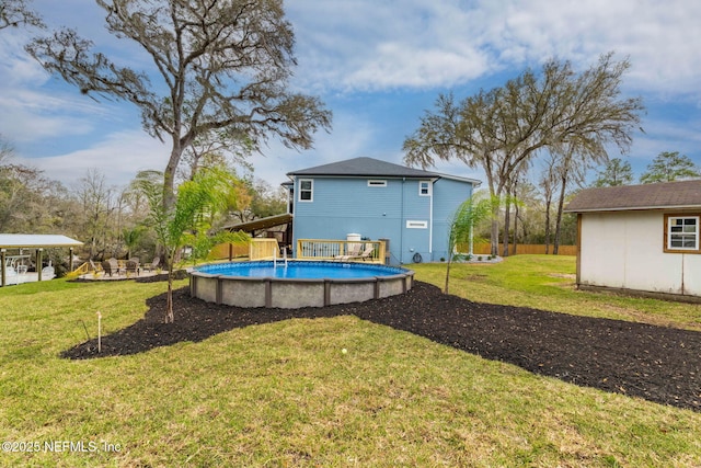 exterior space with an outbuilding, an outdoor pool, and a yard