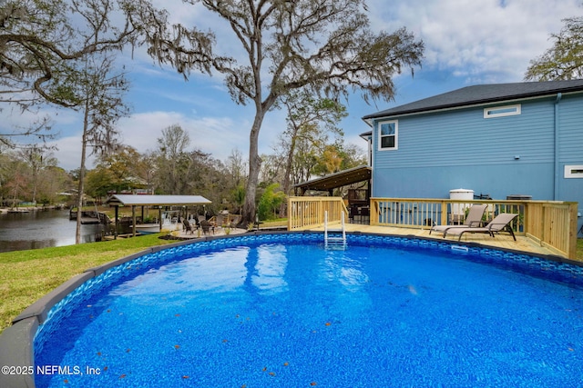 pool featuring a deck with water view