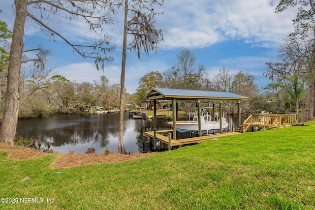 view of dock with a lawn, a water view, and boat lift