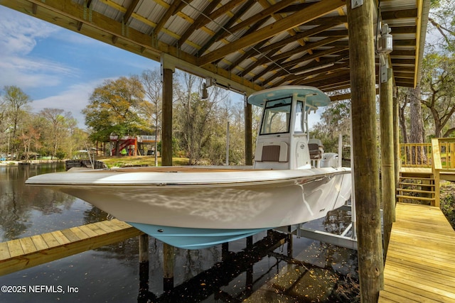 dock area featuring a water view and boat lift