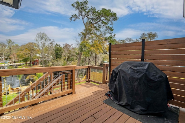 wooden terrace featuring area for grilling