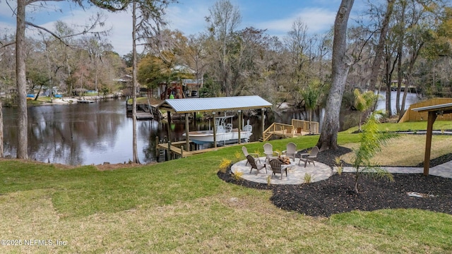 dock area with an outdoor fire pit, boat lift, a water view, a yard, and a patio area