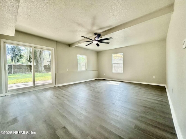 spare room with dark wood-style floors, ceiling fan, and baseboards