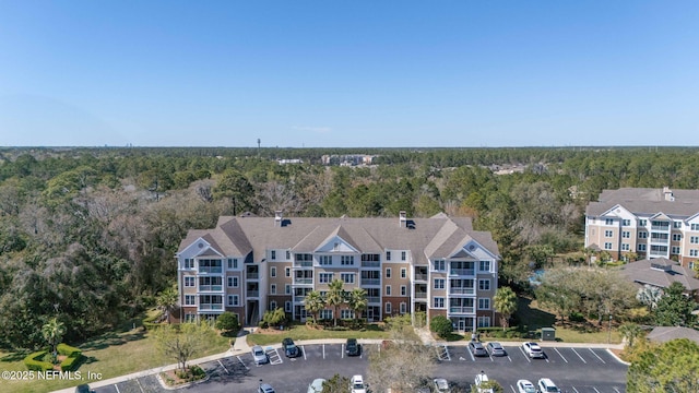 drone / aerial view featuring a view of trees